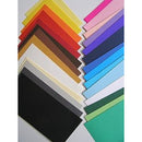 Array of Favini Prismacolour coloured carton sheets in various hues, 220gsm 100x70 cm, showcasing the texture and quality, available at Istiklal Library.
