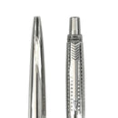 Close-up of a silver pen with detailed design on a white background